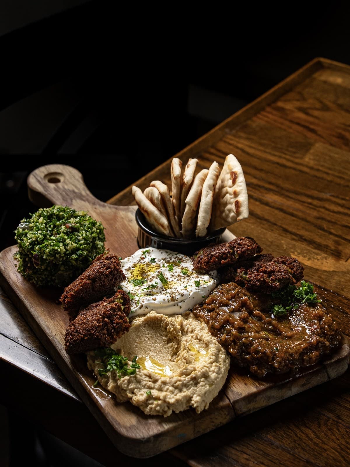 Un Peu De Tout at Cybel: falafel, labneh, hummus, Moroccan ratatouille and tabbouleh served on a board with zaatar pita