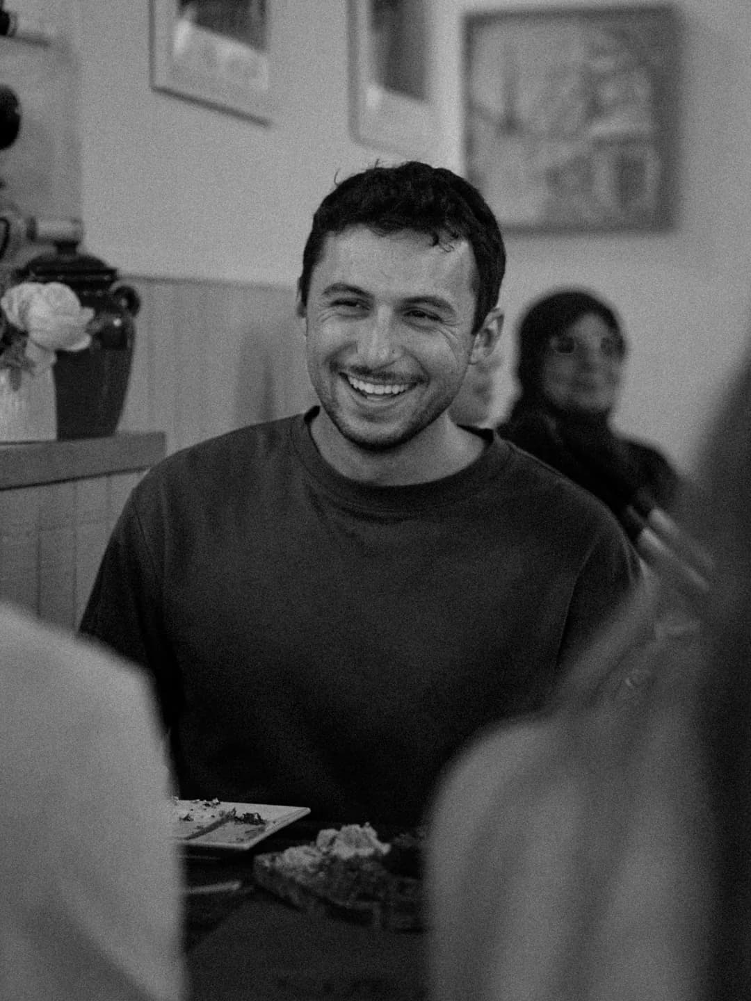 Guest laughing at a table at Cybel